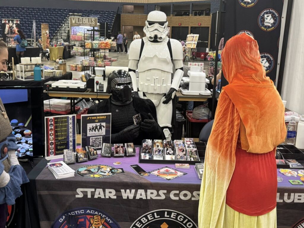 Kylo Ren sitting at a convention table