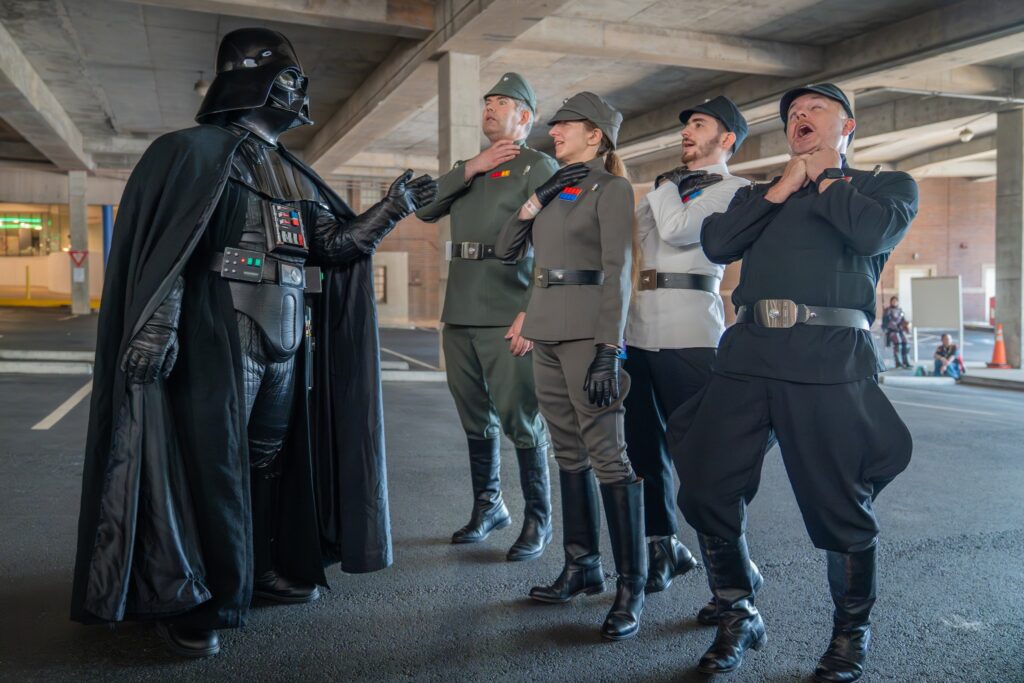 Darth Vader using the Force to choke four Imperial officers