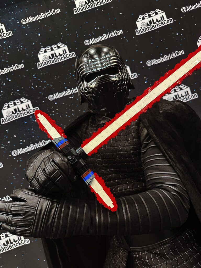 Kylo Ren presenting a lightsaber