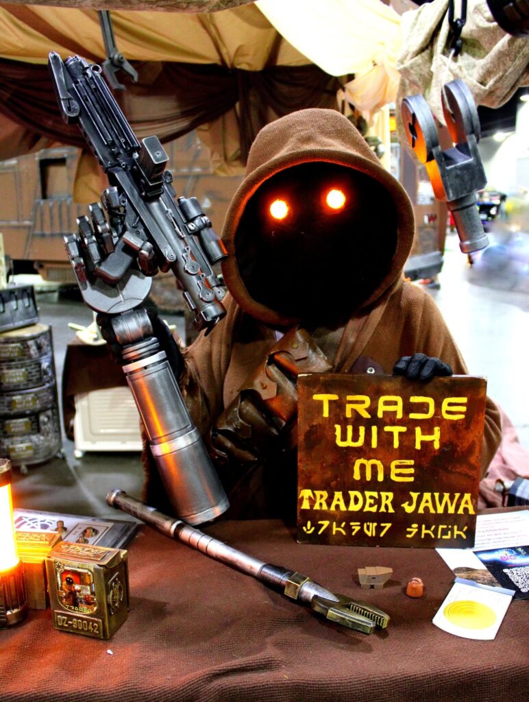 Jawa with a sign reading "Trade With Me"