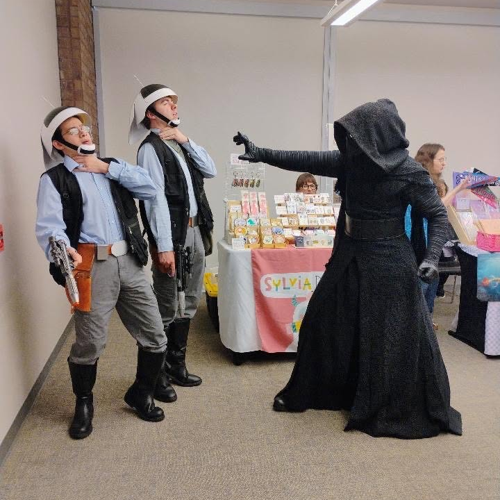 Kylo Ren uses the force on two Rebels
